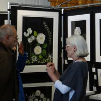 Lady and Man looking at painting